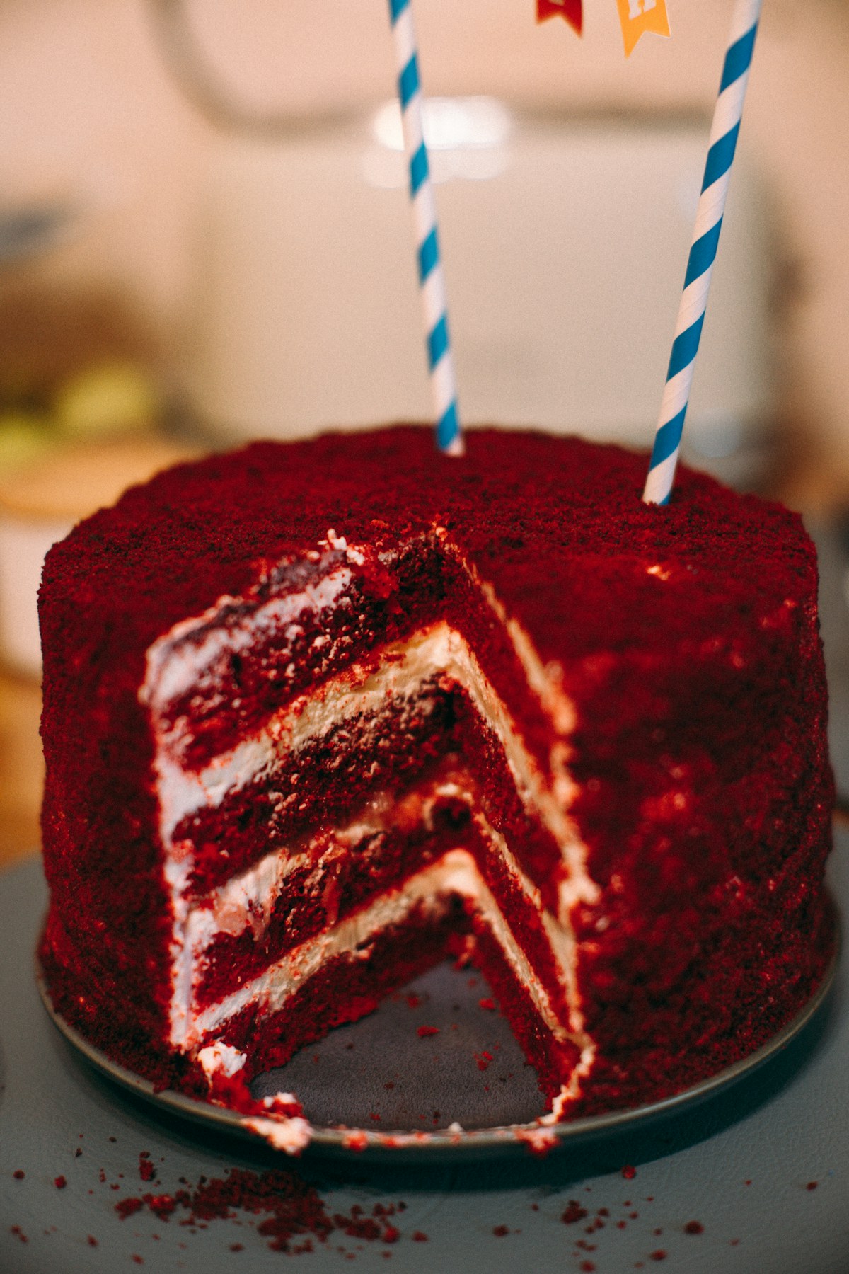 Red velvet celebration cake with candles